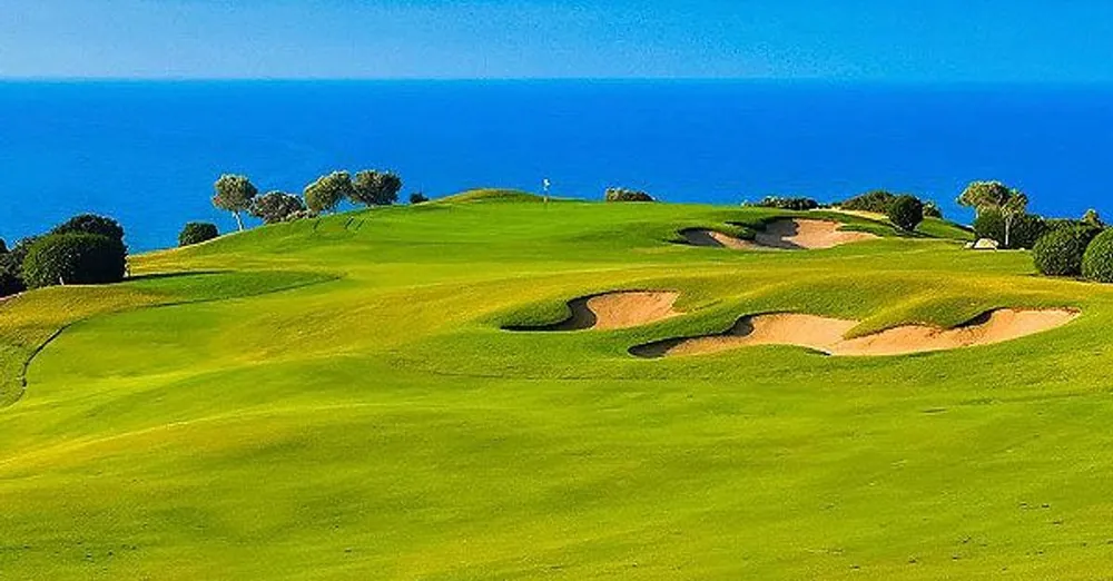 Clifftop green overlooking the sea at Aphrodite Hills Golf Course, Cyprus