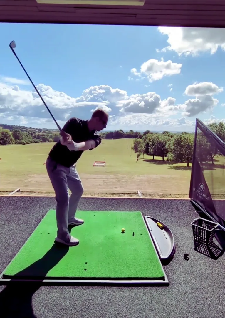 Philip Neil at the top of his backswing on the driving range